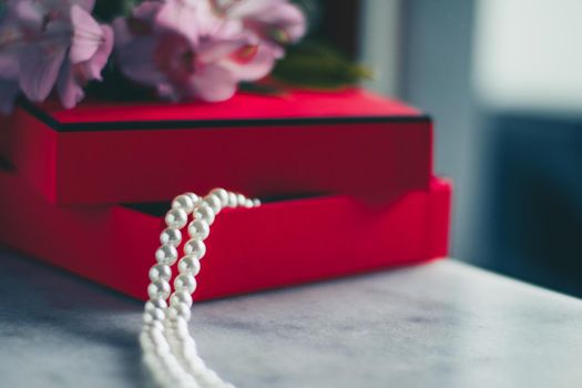 wonderful pearls in a red gift box, luxe present - jewellery and luxury gift for her styled concept, elegant visuals