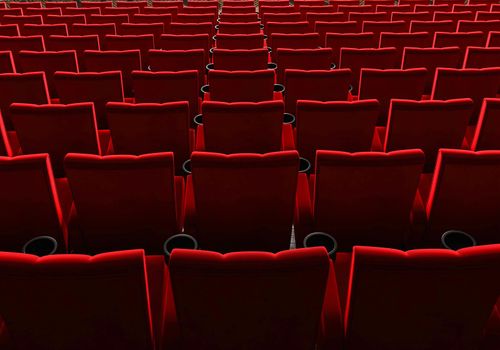 Rows of red velvet seats watching movies in the cinema with copy space banner background. Entertainment and Theater concept. 3D illustration rendering