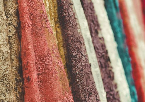 colorful  lace fabric  rolls incolorful lace cloth fabric rolls in textile shop industry textile shop industry