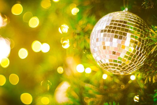 Christmas glitter ball decoration on bokeh background. Colorful blur bokeh background. christmas background