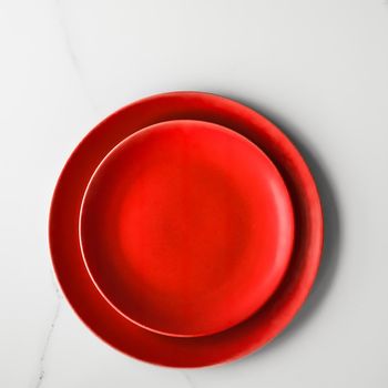 empty red plate on marble - recipe and restaurant mockup flatlay styled concept