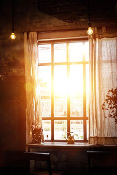 Golden light through window inside room in the morning. Hommie  house design.