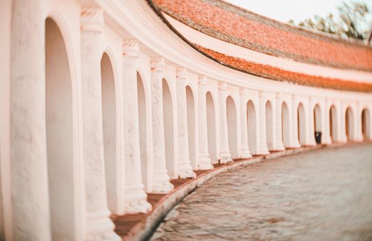 Arch walkway of Phra Pathom Chedi landmark architecture in Thailand.