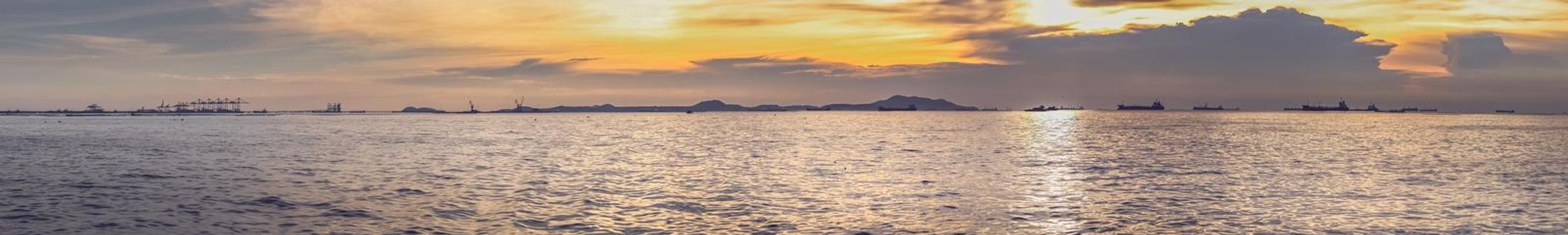 Panorama scenic of mountain lake with perfect reflection at sunrise with hills on background and reflected in water. Nature lake landscape