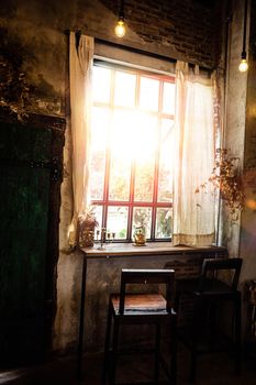 Golden light through window inside room in the morning. Hommie  house design.