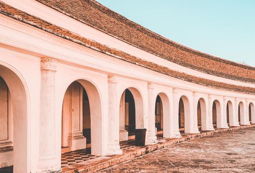 Arch walkway of Phra Pathom Chedi landmark architecture in Thailand.