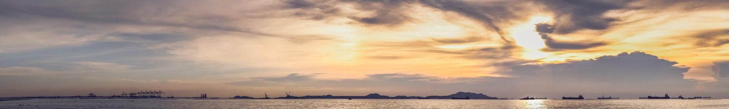 Panorama scenic of mountain lake with perfect reflection at sunrise with hills on background and reflected in water. Nature lake landscape