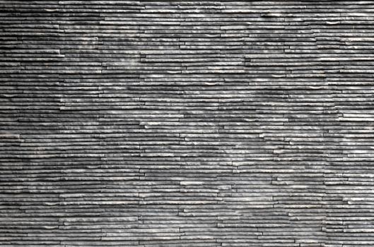 Black dark stone line texture background. Material decoration in architecture and interior design.