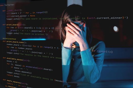 A young girl works on a laptop late at night online, a woman is coding, writing a program, using her device to create a new project and e-learning, getting an IT education for future development.