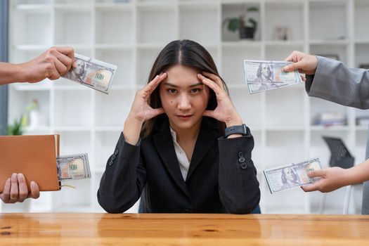 Asian woman refusing money in the envelope to agreement contract, Bribe and corruption concept.