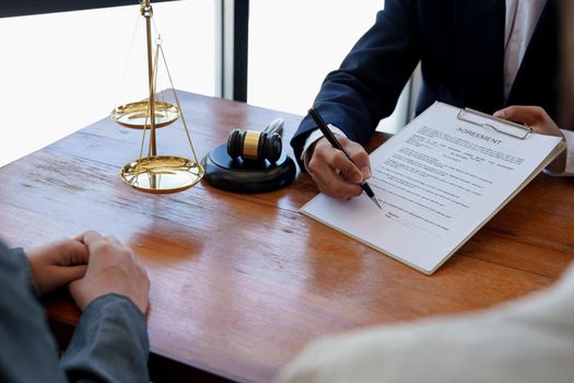 The hand of a business man is using the index finger to let the customer sign the contract, contract, business agreement