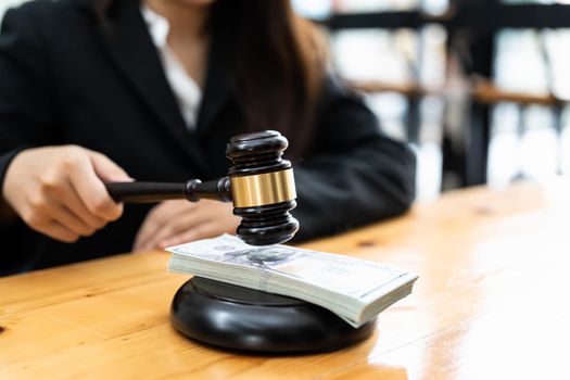 Judges Or Auctioneer Gavel On The Dollar Cash Background, Concept For Corruption, Bankruptcy, Auction Bidding, Fines.