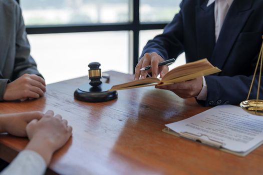 Couple customers consulting realtor lawyer or insurer about buying house or insurance services, salesman, bank worker or financial advisor making presentation offer to clients at meeting in office.