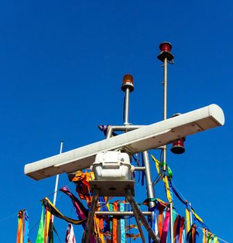 Navigation equipment on top of the decorated boat close up