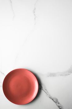 empty red plate on marble - recipe and restaurant mockup flatlay styled concept