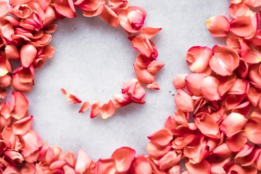 coral rose petals on marble, color of the year - flower backgrounds and holidays styled concept