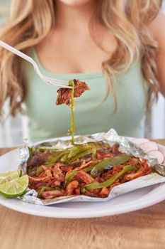 girl eating delicious typical mexican food, tacos, sopes, pastor, etc. variety of delicious typical mexican food