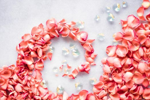 coral rose petals on marble, color of the year - flower backgrounds and holidays styled concept