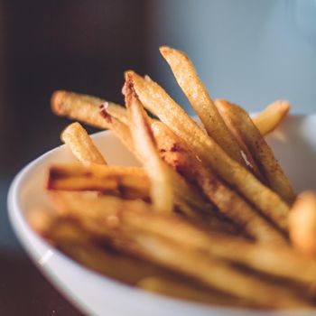 rustic food and homemade cooking styled concept - just cooked french fries served, elegant visuals