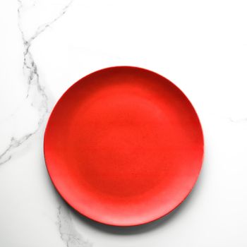 empty red plate on marble - recipe and restaurant mockup flatlay styled concept