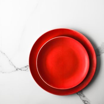 empty red plate on marble - recipe and restaurant mockup flatlay styled concept