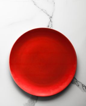 empty red plate on marble - recipe and restaurant mockup flatlay styled concept