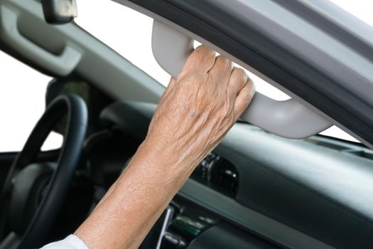 Elderly woman on car