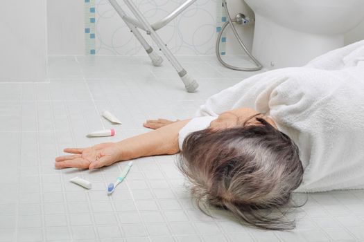 Elderly woman falling in bathroom because slippery surfaces