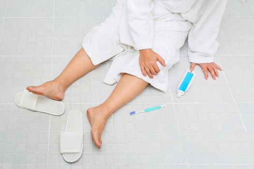 Woman falling in bathroom because slippery surfaces