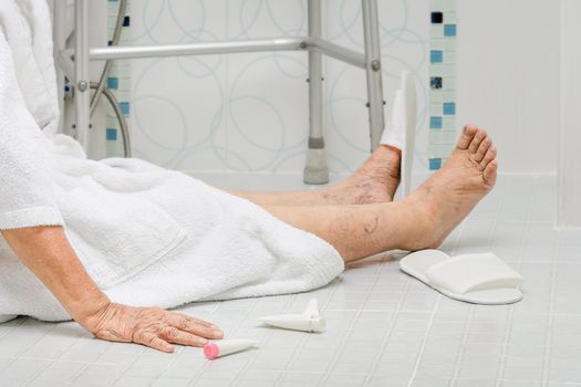 Elderly woman falling in bathroom because slippery surfaces