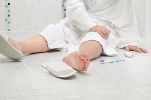 Woman falling in bathroom because slippery surfaces