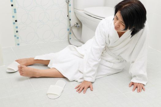 Woman falling in bathroom because slippery surfaces