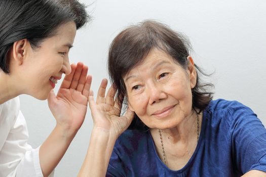 Asian seniors woman hearing loss , Hard of hearing