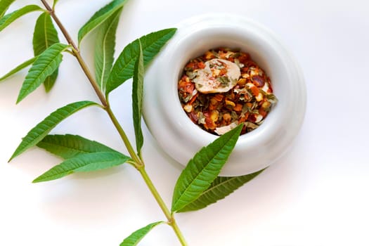 Spices in a bowl and Verbena on a table
