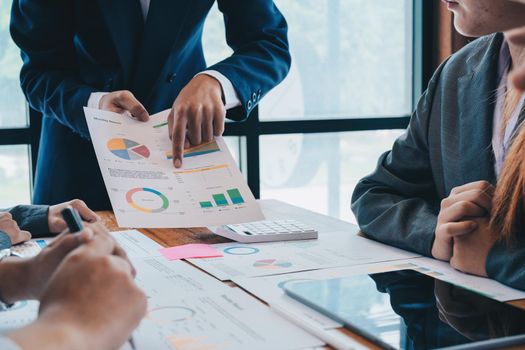 Business People Meeting to analyse and discuss and brainstorming the financial report chart data in office Financial advisor teamwork and accounting concept