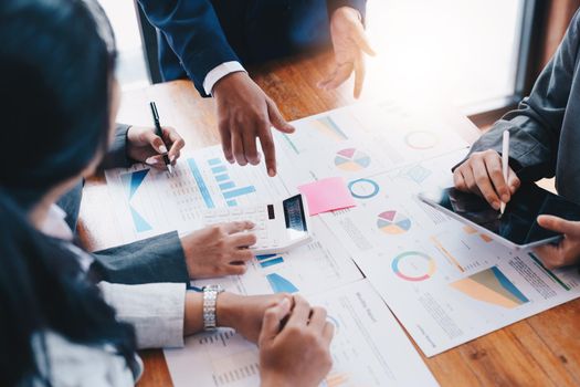 Asian business adviser meeting to analyze and discuss the situation on the financial report in the meeting room.Investment Consultant, Financial advisor and accounting concept