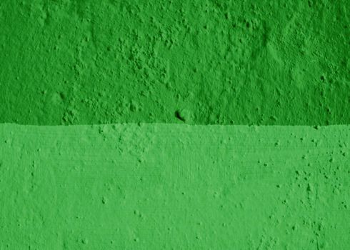 The wall is painted in two shades of green.