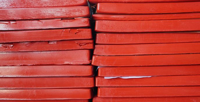 Plates of gelatin stacked in two piles. Remelted gelatin in the form of plates.