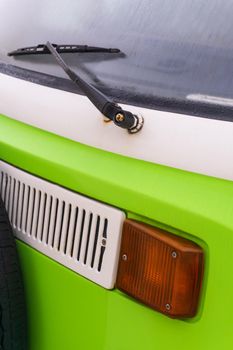 Detail of a white - green Volkswagen travel van close up