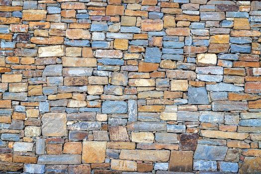 The surface of an old stone wall, perfect for the background. Close