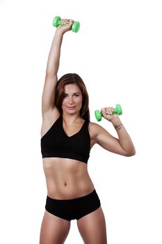 Fitness happy girl with dumbbells on a white background in black clothes