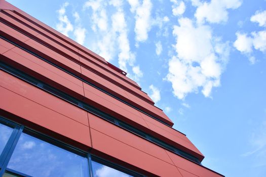 Modern red building with offices and glass windows