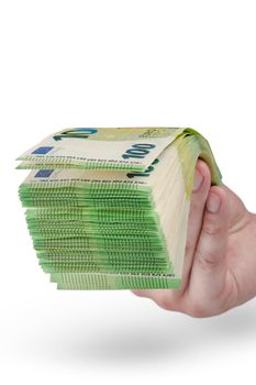 Stack of money in hand isolated on white background. 100 euro banknotes in a man's hand. A man holds out his hand with a stack of banknotes as a concept for a loan, insurance or mortgage