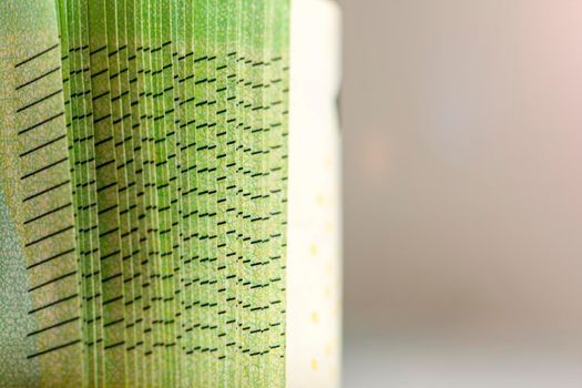 Close-up of a stack of paper bills, side view. Euro banknotes stacked on top of each other. Big pile of money