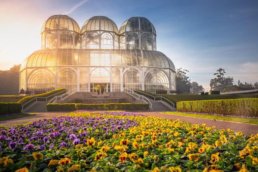 Public park around Botanical garden greenhouse in Curitiba at golden sunrise, Parana, southern Brazil