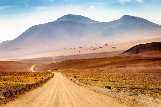 Country road in Atacama desert, volcanic arid landscape in Northern Chile border with Bolivia, South America