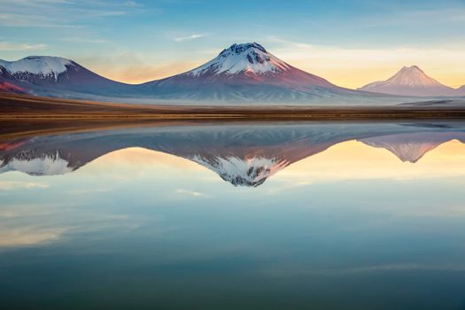 Idyllic Lake Lejia reflection and volcanic landscape in Atacama desert, Northern Chile, South America