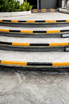 Yellow and black stripes, safety symbols at the edge of the stairs