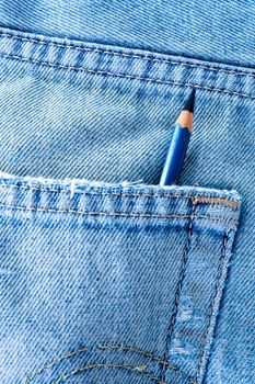 EE type Pencil in the pocket of denim blue jean