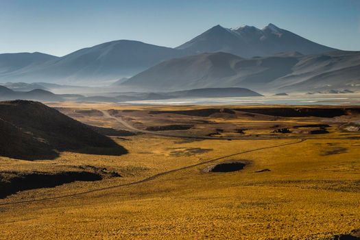 Country road in Atacama desert, volcanic arid landscape in Northern Chile border with Bolivia, South America